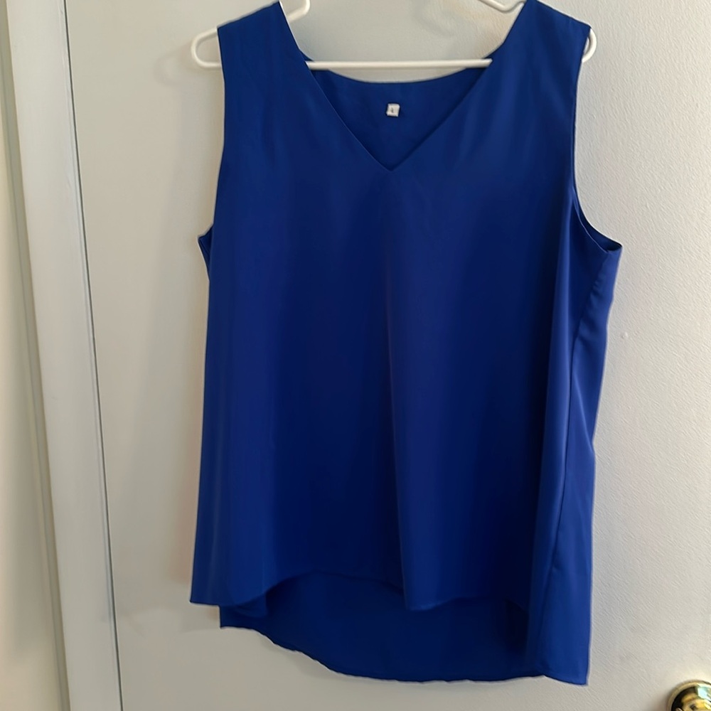 Royal blue, v-neck, sleeveless shell, polyester, lined.